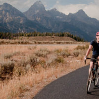 Ben Martin rides along a multipurpose pathway in Grand Teton National Park in October 2011. Martin opposes a proposed federal law that would require bikers to use pathways instead of adjacent roads. (Photo ©2011 Breeanne Martin)