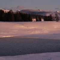 A lone bison stands at the edge of Indian Pond as the sun sets in Yellowstone National Park. (Ruffin Prevost/Yellowstone Gate - click to enlarge)