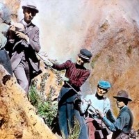 A colorized photo shows early Yellowstone National Park visitors climbing along Uncle Tom's Trail. (Yellowstone Digital Slide File)