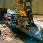 National Transporation Safety investigator Zoë Keliher from Boise, Idaho inspects wreckage of the RV7 aircraft that crashed in Grand Teton National Park on Wednesday.