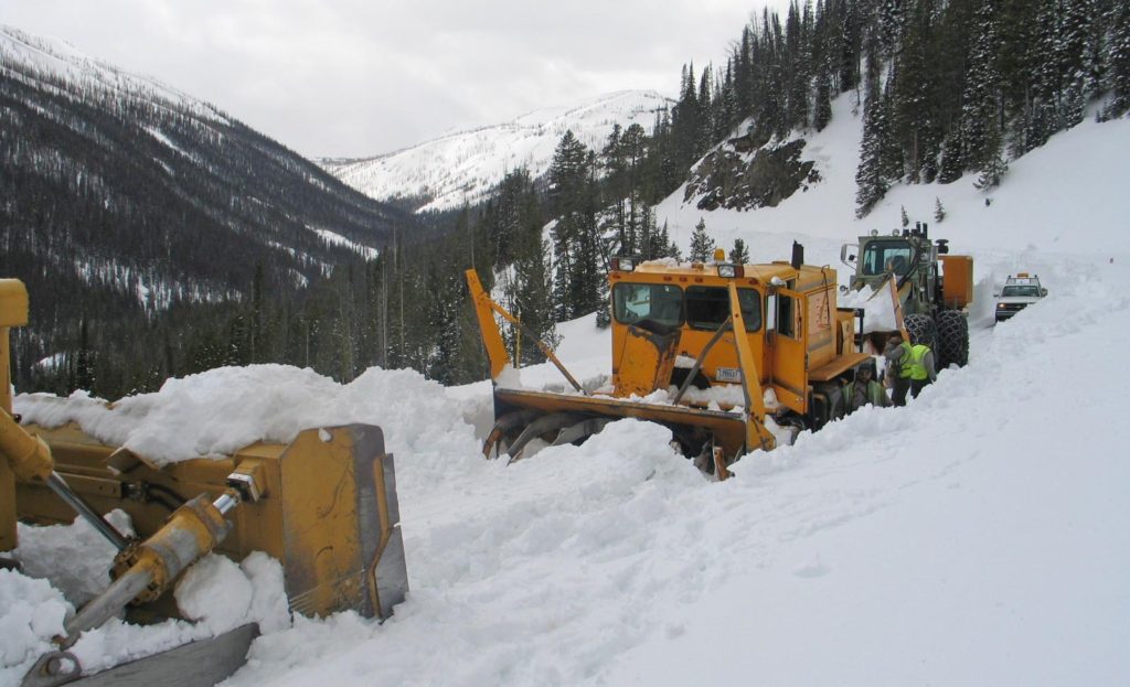 Crews work earlier this spring to plow Sylvan Pass, the highest point along the east entrance road into Yellowstone National Park. (National Park Service photo - click to enlarge)