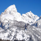 A helicopter heads toward Garnet Canyon in this file photo from April 2011 taken during a search for two lost skiers in Grand Teton National Park. Two snowboarders were rescued Feb. 13 after mistakenly riding into Granite Canyon. (National Park Service photo by Jackie Skaggs — click to enlarge)