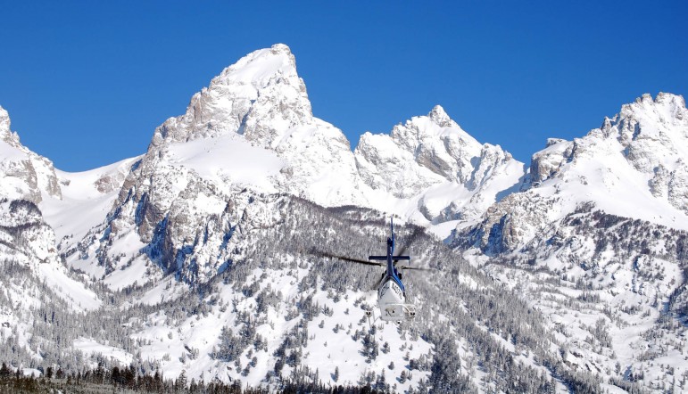 A helicopter heads toward Garnet Canyon in this file photo from April 2011 taken during a search for two lost skiers in Grand Teton National Park. Two snowboarders were rescued Feb. 13 after mistakenly riding into Granite Canyon. (National Park Service photo by Jackie Skaggs — click to enlarge)