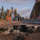 Traffic in 2012 moves along a single lane of the then-damaged road between Sylvan Pass and Fishing Bridge in Yellowstone National Park.