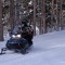 Two people share a snowmobile during a January 2012 trip into Yellowstone National Park.