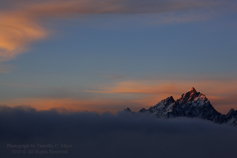 Grand Teton first light above the fog off Jackson Lake