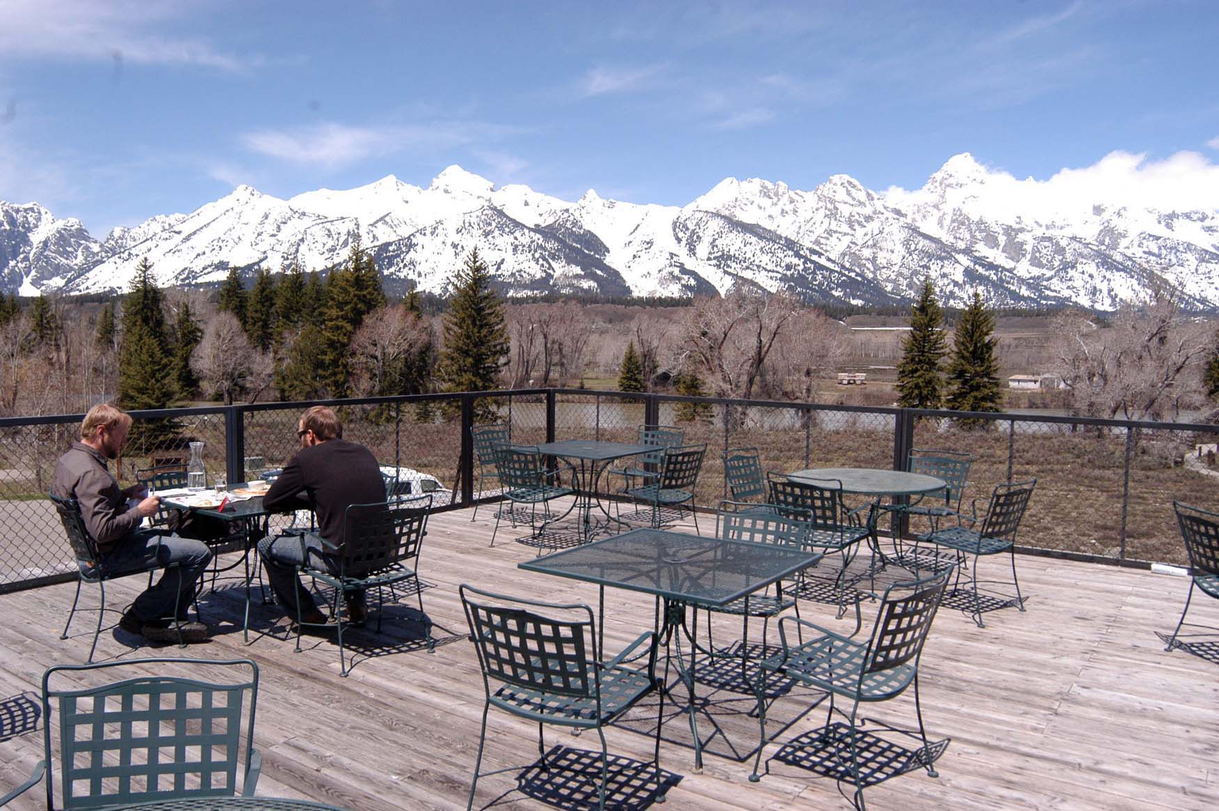 Jason Lesli, left, and Duane Nardi have lunch on the rooftop deck of Dornan's restaurant in May 2011 in Grand Teton National Park. (Ruffin Prevost/Yellowstone Gate)