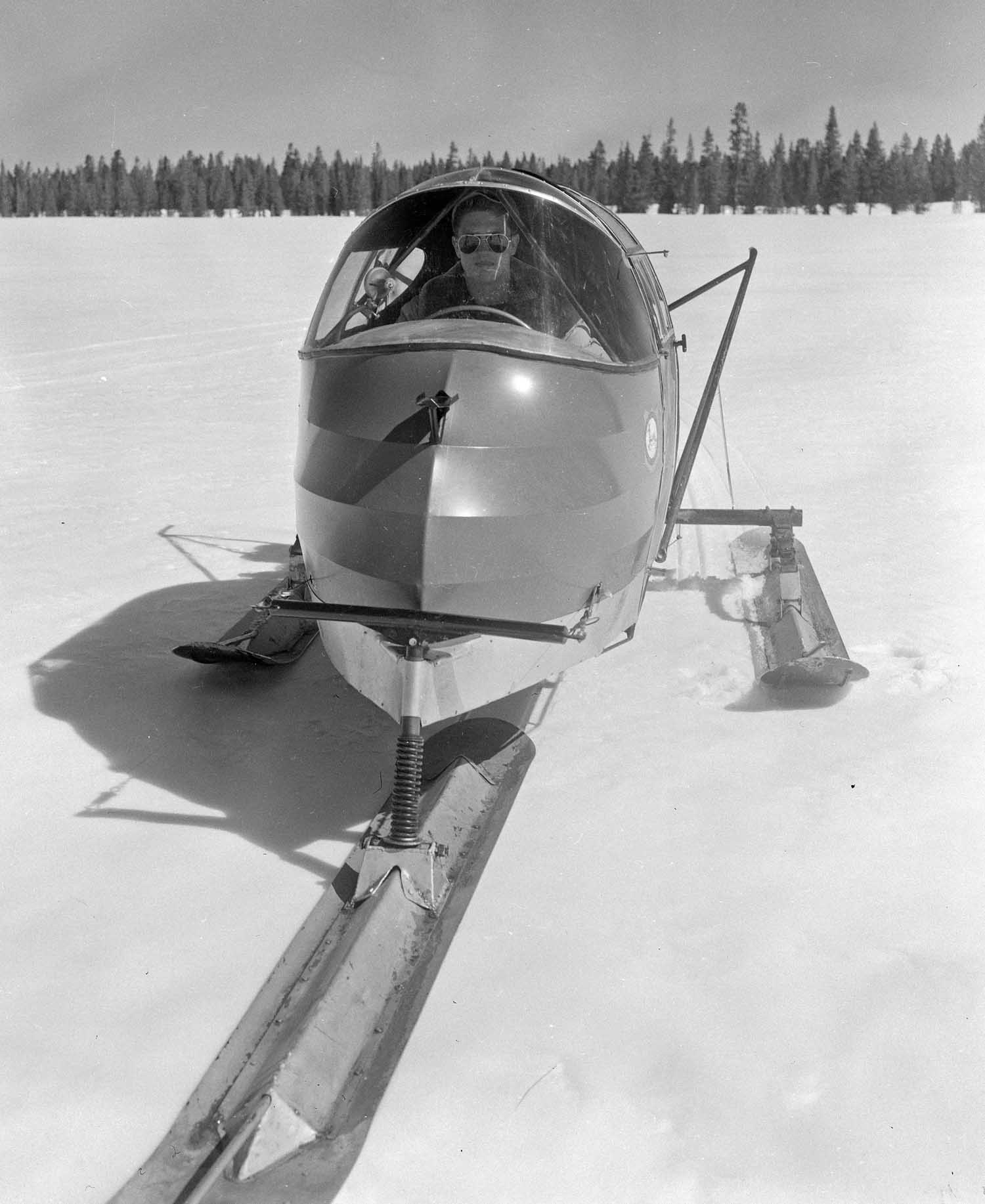 Ranger Bob Richard sits in a snow plane on Yellowstone Lake in the 1950s. The two-person vehicles used a small rear-mounted airplane engine and propeller to glide across ice and snow at high speeds. (Jack Richard photo courtesy of Buffalo Bill Historical Center - click to enlarge)