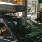 Candice Phipps, a worker at the East Gate to Yellowstone National Park, checks passes of visitors arriving from Cody in this 2012 file photo.