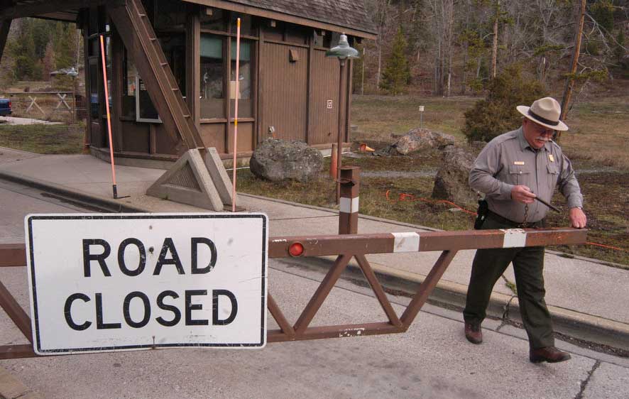 Dennis Lenzendorf opens the Yellowstone East Gate on Friday for the first day of the 2012 summer season. (Ruffin Prevost/Yellowstone Gate - click to enlarge)