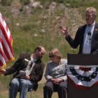 Bill Berg speaks during the Gardiner Gateway Project launch in Gardiner, Mont., sharing the stage with Daniel Bierschwale, President, Gardiner Chamber of Commerce and Clara Conner, Division Engineer, Western Federal Lands Highway Division. (Yellowstone Gate/Ruffin Prevost - click to enlarge)