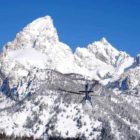 A helicopter heads toward Garnet Canyon in April 2011 during a search for two lost skiers in Grand Teton National Park. (National Park Service file photo by Jackie Skaggs - click to enlarge)