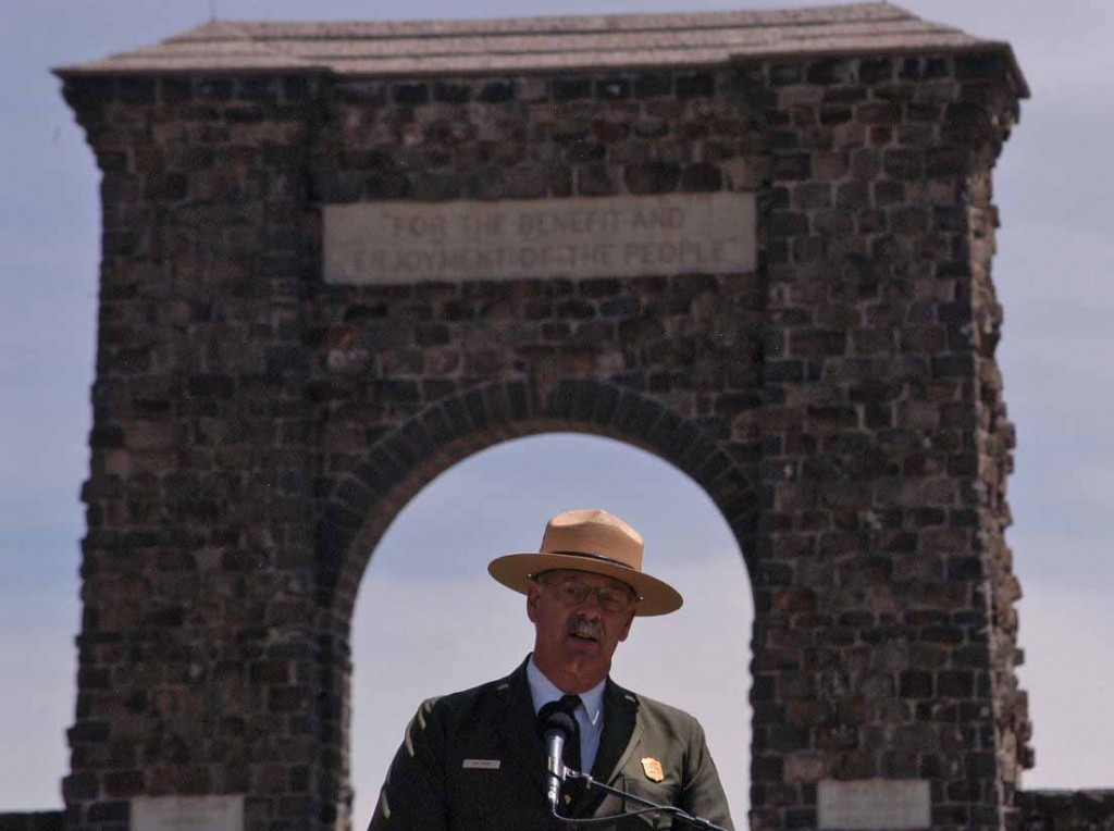 Yellowstone National Park Superintendent Dan Wenk speaks Thursday in front of the Roosevelt Arch during a kickoff event for a project that will reconfigure the North Entrance to the park. (Ruffin Prevost/Yellowstone Gate - click to enlarge)