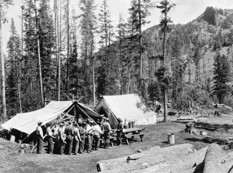 Firefighters move through a chow line during the 1937 Blackwater Fire east of Yellowstone National Park. Fifteen firefighters were killed in the blaze, and a series of events are scheduled for the 75th anniversary of the blaze. (Jack Richard photo courtesy of Buffalo Bill Historical Center McCracken Research Library PN.89.114.21398.4)