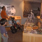 Brooke Wayne, left, Yuji Tsuno and their sons St. John, left, and Ruffin visit the Heart Mountain Interpretive Center east of Yellowstone National Park. (Ruffin Prevost/Yellowstone Gate - click to enlarge)