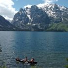 A group paddles a canoe on Jenny Lake in Grand Teton National Park. (Ruffin Prevost/Yellowstone Gate file photo - click to enlarge)