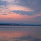 A lone light shines on the Grand Loop Road west of Lake Hotel as viewed at sunrise from Bridge Bay in Yellowstone National Park. (Ruffin Prevost/Yellowstone Gate - click to enlarge)