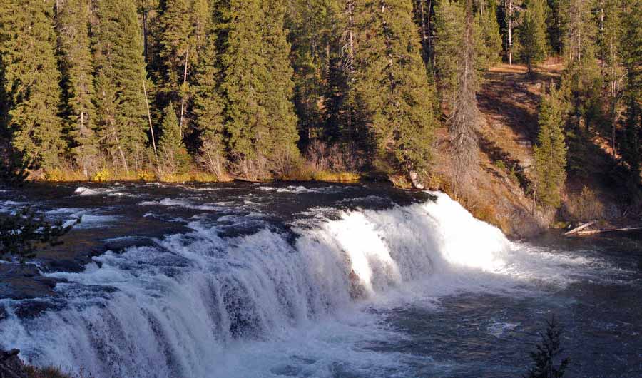 Cave Falls is 250 feet wide, making it the widest waterfall in Yellowstone National Park. It is located in the Bechler area in the southwestern corner of Yellowstone. (Ruffin Prevost/Yellowstone Gate - click to enlarge)