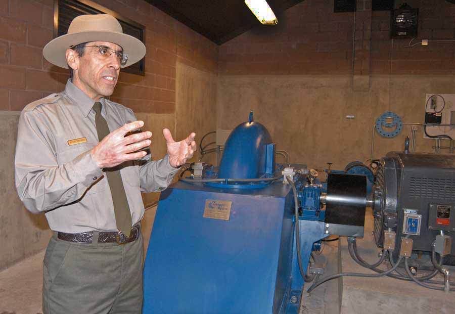 Peter Galindo, a project engineer for Yellowstone National Park, discusses a new small-scale hydro-electric power system now in use near Mammoth Hot Springs. (Ruffin Prevost/Yellowstone Gate - click to enlarge)