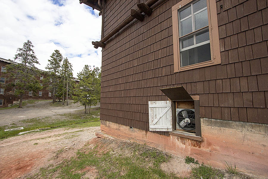 A fan helps cool the crawl space in a building currently over warm ground.