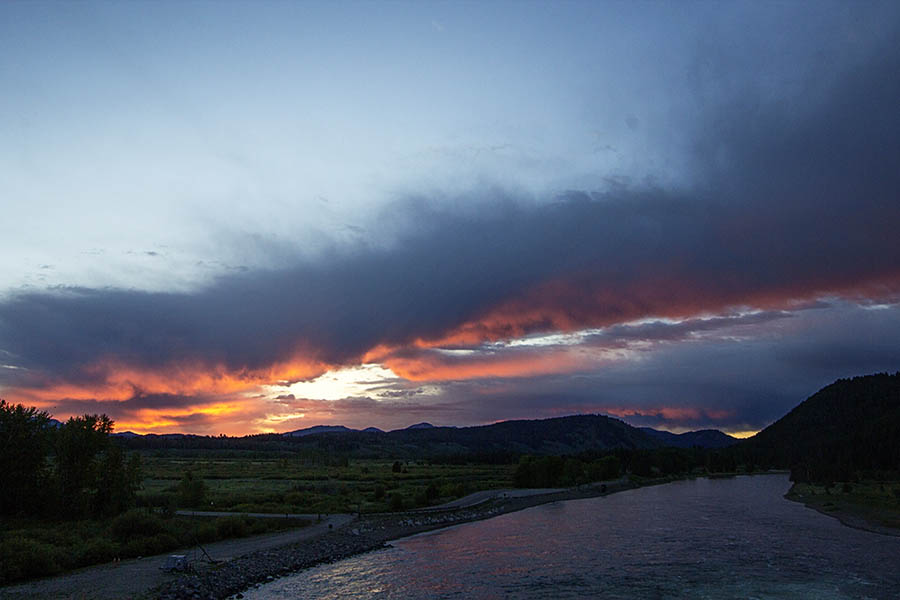 A colorful sunrise lights up the morning sky in Grand Teton National Park. (© Janet White/GeyserWatch.com)