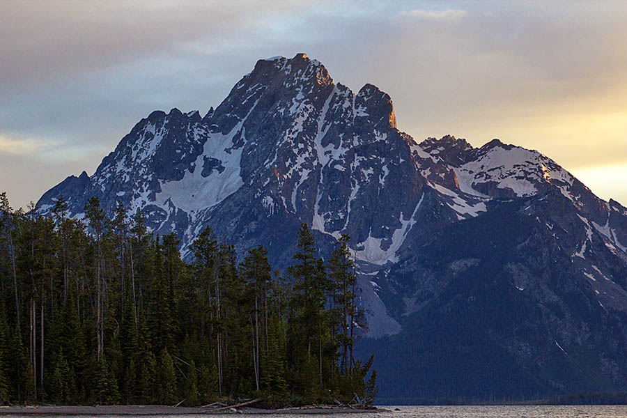 The last light of the longest day of the year kisses a bit of color onto Mt. Moran in Grand Teton National Park (© Janet White/GeyserWatch.com)