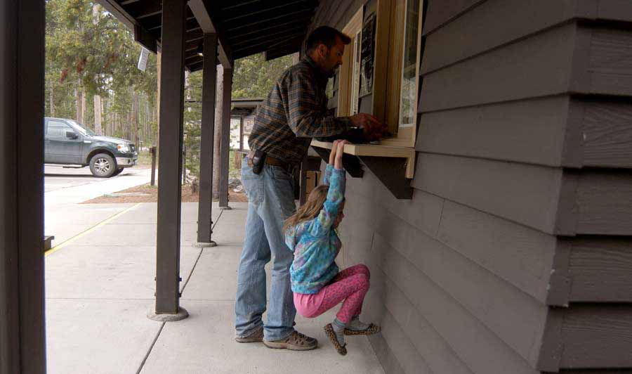 Josh and Avery Reese check into the Madison Campground in Yellowstone National Park. (Ruffin Prevost/Yellowstone Gate)