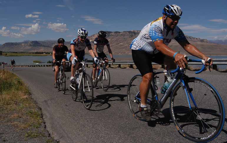 Bicyclists participate in Cycle Greater Yellowstone near the Buffalo Bill Reservoir southwest of Cody, Wyo.
