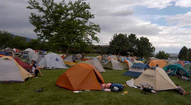 Bicyclists participating in Cycle Greater Yellowstone relax at their campsite last week at the Park County Complex in Cody, Wyo.