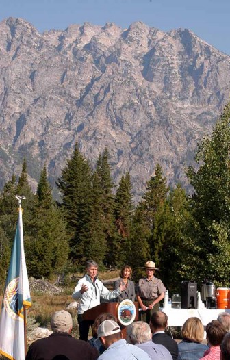 Interior Secretary Sally Jewell, left, speaks at Jenny Lake on Thursday in Grand Teton National Park in support of a Grand Teton National Park Foundation project to improve trails and visitor amenities in the area. Joining her in the announcement of the $16 million public-private fundraising initiative were Grand Teton Superintendent Mary Gibson Scott, right, and foundation President Leslie Mattson. (Ruffin Prevost/Yellowstone Gate)