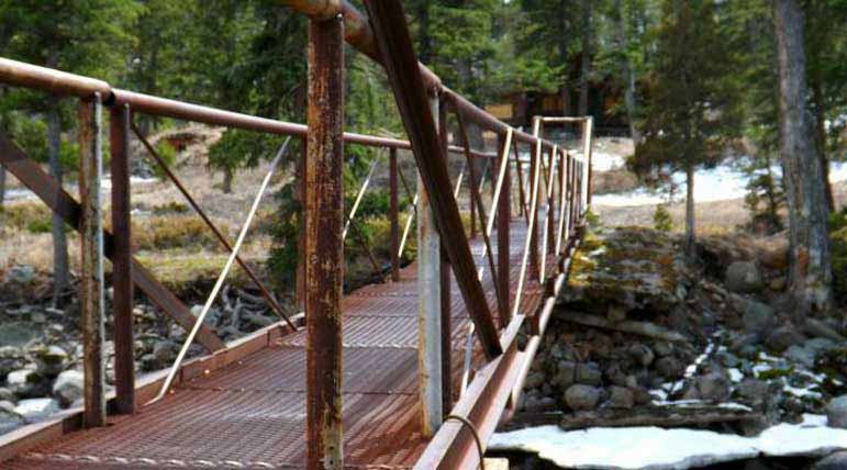 An old metal bridge crosses the North Fork of the Shoshone River east of Yellowstone National Park. Sterling Boone Cody High School