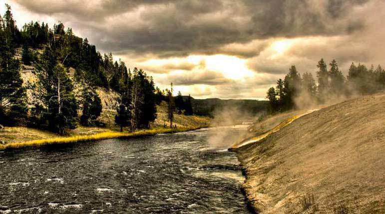 An overcast sky creates dramatic lighting along a steaming river in Yellowstone National Park. Dylan Rorabaugh Natrona County High School