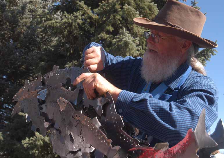 Charles Ringer assembles a sculpture Saturday during the Buffalo Bill Art Show Quick Draw in Cody, Wyo.