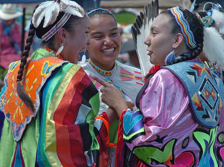 Cody, Wyo. is an authentic Western town that is home to several family-friendly attractions and events, including the Plains Indian Pow Wow at the Buffalo Bill Center for the West. Mikala SunRhodes, from left, Jasmine Walks Over Ice and Tia Hoops chat between dances at the 2008 Plains Indian Pow Wow.