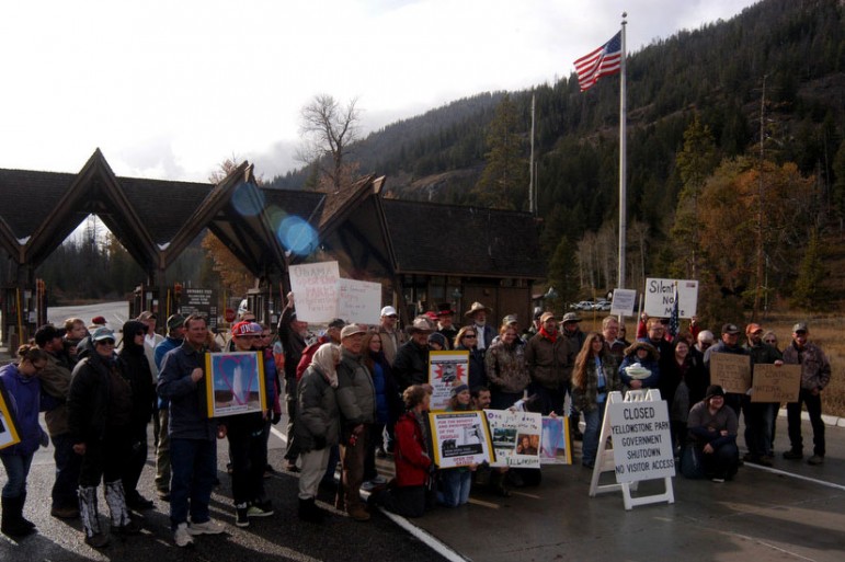 Protestors gather at the East Gate to Yellowstone National Park on Sunday to demand a solution to the federal government shutdown that has closed national parks nationwide. 
