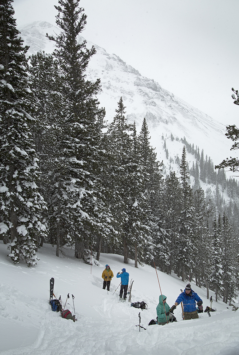 Participants in an avalanche forecasting course practice digging snow pits and recording snowpack conditions.