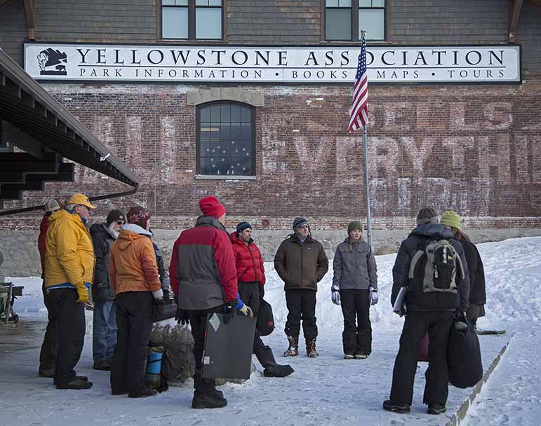 Students discuss what they have learned after a wilderness first aid training session outside the Yellowstone Association building in Gardiner, Montana.