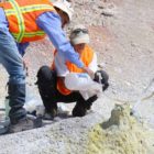 Researchers collect gas samples form a fumarole in Yellowstone National Park as part of a study aimed at learning more about the processes at work beneath the park's thermal features.