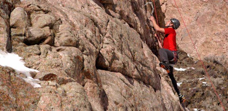 A climber scales a rock wall in Shoshone Canyon on Saturday during the 16th Annual Cody Ice Climbing Festival in Cody, Wyo. (Ruffin Prevost/Yellowstone Gate)