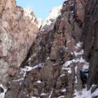 A climber looks for the best route up a rock face in Shoshone Canyon on Saturday during the 16th Annual Cody Ice Climbing Festival in Cody, Wyo.