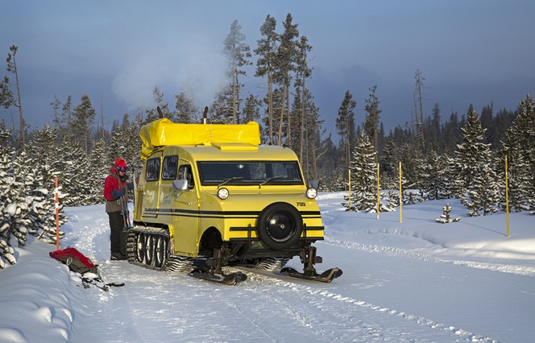 A snow coach drops off skiers near Kepler Cascades in Yellowstone National Park.