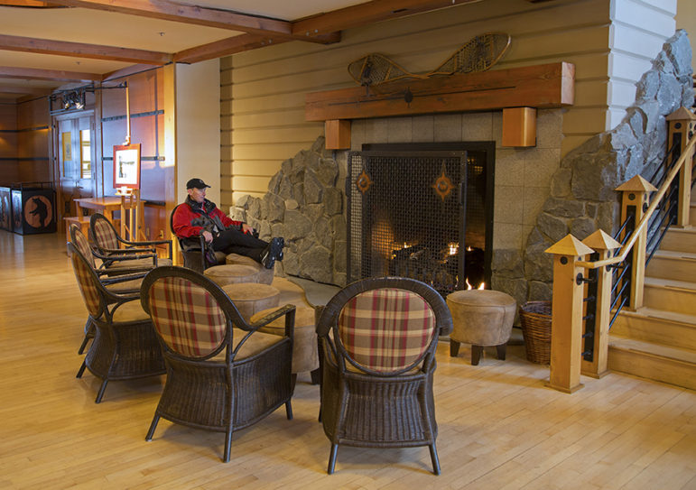 The fireplace at Old Faithful Snow Lodge offers a spot where winter travelers to Yellowstone National Park can warm up.