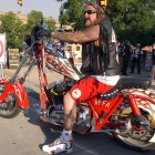 A Hells Angels member from Arizona checks traffic during the 2006 World Run in Cody, Wyo. before pulling onto Sheridan Avenue.