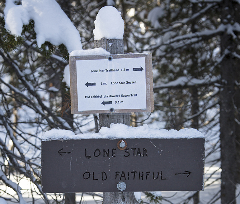 A sign points the way along a trail between Lone Star and Old Faithful geysers in Yellowstone National Park.