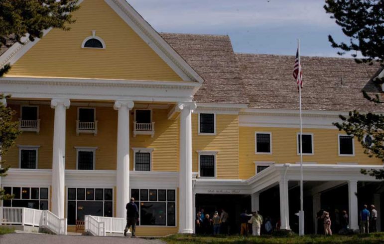 People gather Tuesday for a ribbon-cutting celebrating completion of a 2-year, $28.5 million renovation of Lake Hotel in Yellowstone National Park.