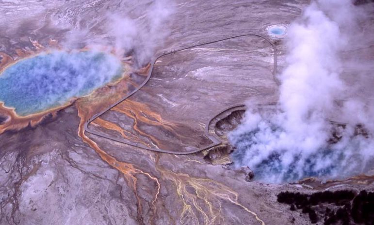 Steam rises from Excelsior Geyser Crater and Grand Prismatic Spring in Yellowstone National Park.