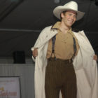 A model opens a duster from WahMaker during the Cody High Style Fashion show on Wednesday in Cody, Wyo.