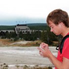 Self-described 'geyser gazer' Ryan Maurer takes notes after the eruptions of Lion Geyser in Yellowstone National Park.