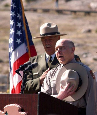 Michael Breis sings "The Star-Spangled Banner" as Yellowstone National Park Superintendent Dan Wenk looks on during a Sept. 3 naturalization ceremony at Mammoth Hot Springs.