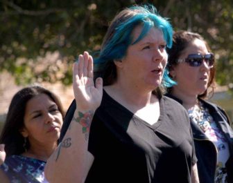 Sharri Roberts of Star Valley, Wyo. recites the oath of citizenship during a Sept. 3 naturalization ceremony at Mammoth Hot Springs in Yellowstone National Park